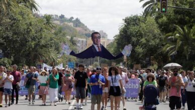 People demonstrate against mass tourism in Malaga