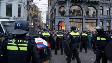 Pro-Palestinian protesters take part in a banned demonstration in Amsterdam