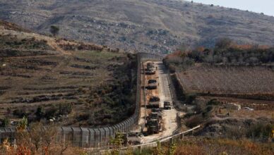 Israeli soldiers gather near the ceasefire line between Syria and the Israeli-occupied Golan Heights